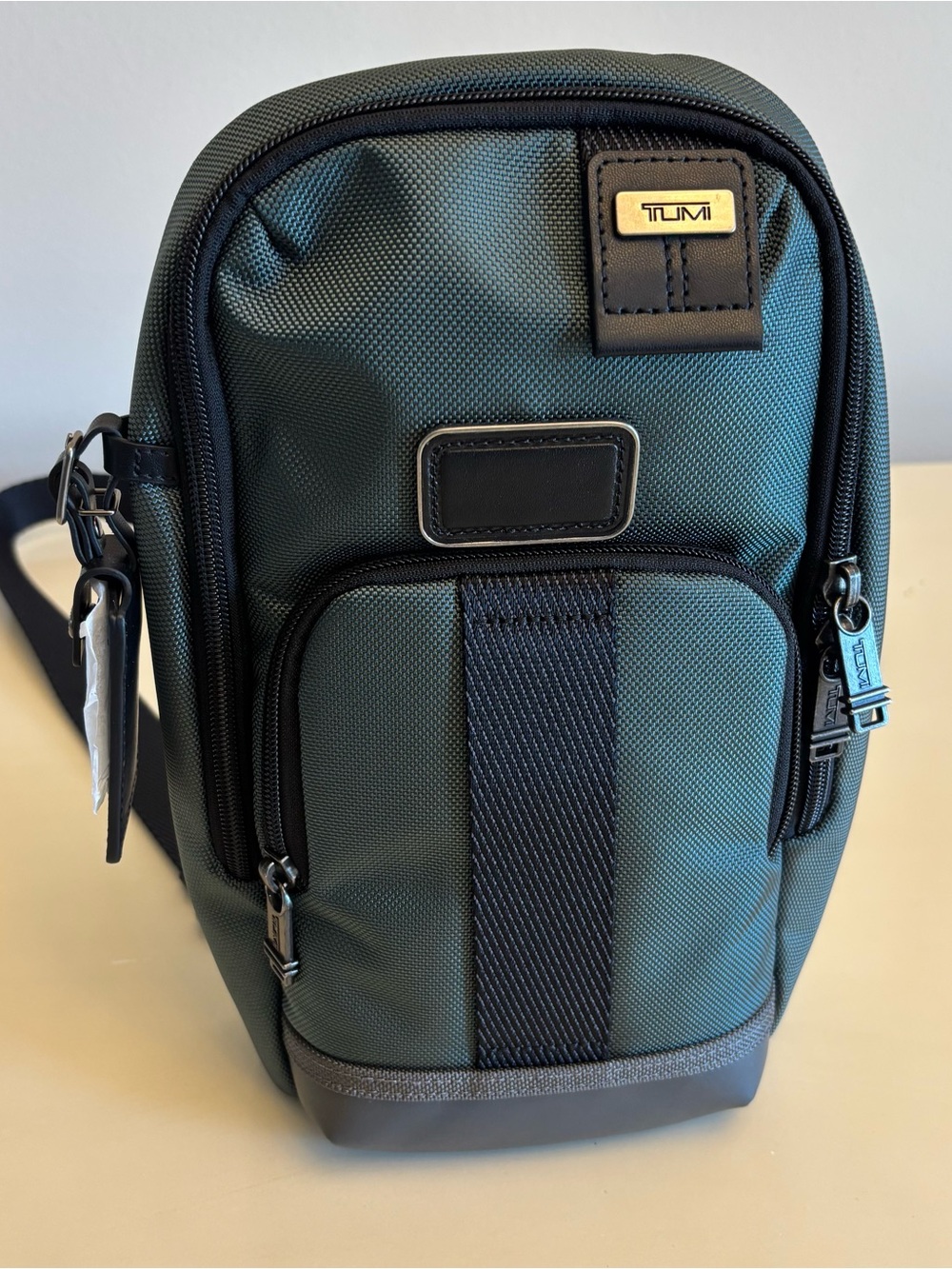 Tumi Fife Slim Sling bag backpack green/ black nylon / leather NEW